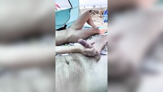 She was playing with my dick on the public nude beach until I cum. Loads of natural cum