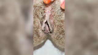 Delicious big hairy pussy pissing from urethra close up