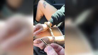 Roxy handcuffed on a car ride