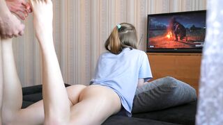 Playing with my stepsister's tight pussy while she plays console